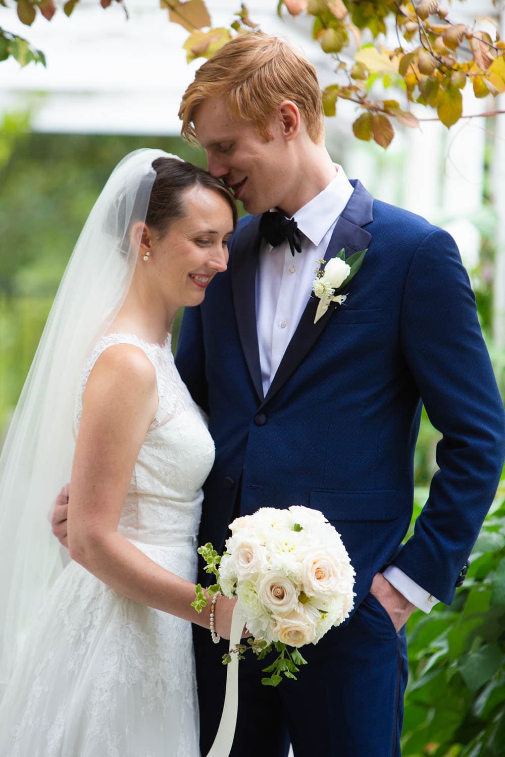 The bride and groom share a tender moment after their first look but before the wedding ceremony.