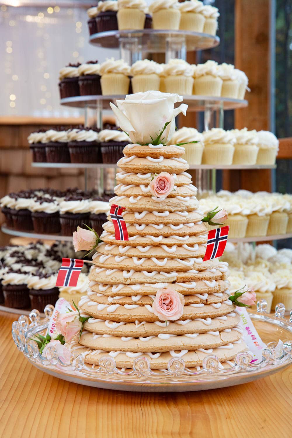Norwegian Wedding Cake with Norwegian flags and pink and white roses. Called kransekakes, these ring cakes are used in Scandinavia for celebrations of all kinds.